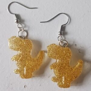 Gold glittery dinosaur earrings